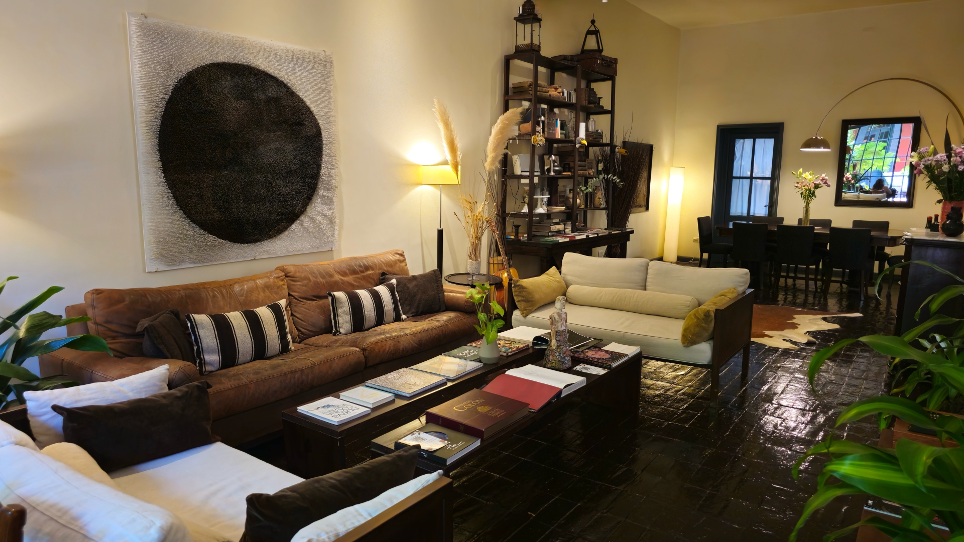 A cozy guest bedroom named after literary greats, featuring soft textiles and curated artwork chosen by Eleanor Coppola.