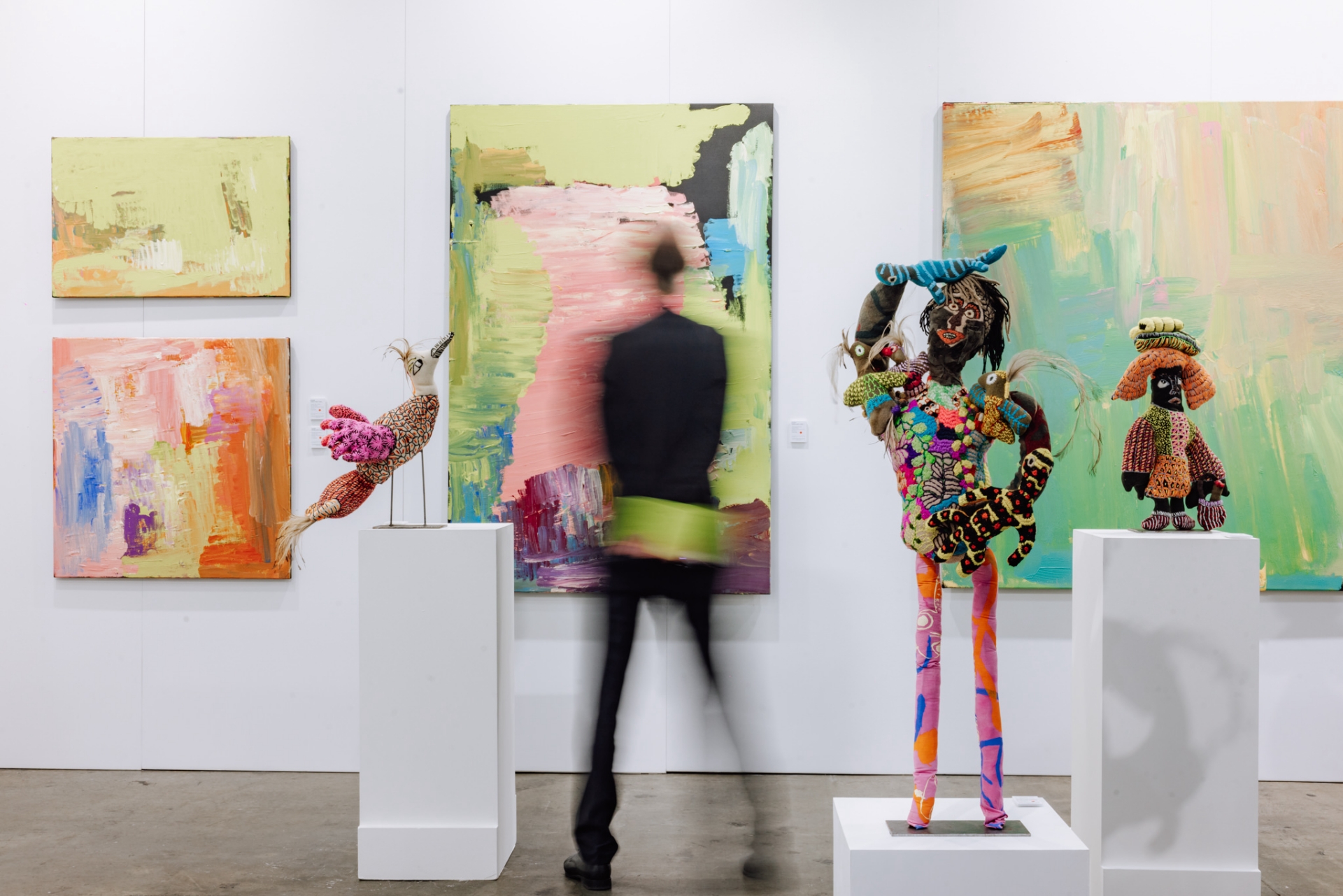 Art enthusiasts and collectors mingling among leading galleries at the Melbourne Convention and Exhibition Centre.
