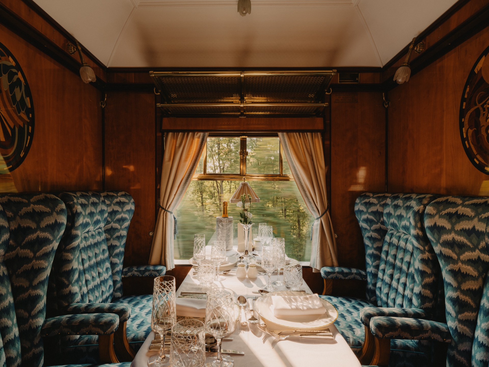 Luxury lunch table setting with crystal glassware and fine china aboard Belmond British Pullman