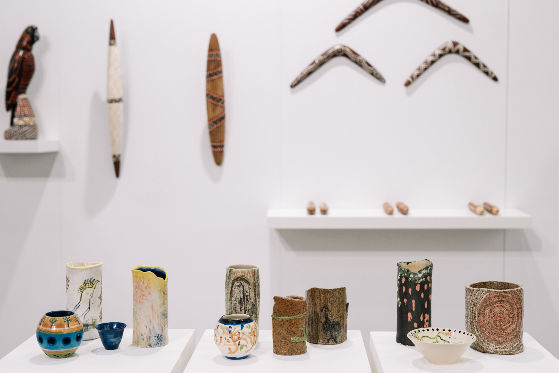 Intricate details of woodwork and cultural artifacts within the Victorian First Peoples Art and Design Fair