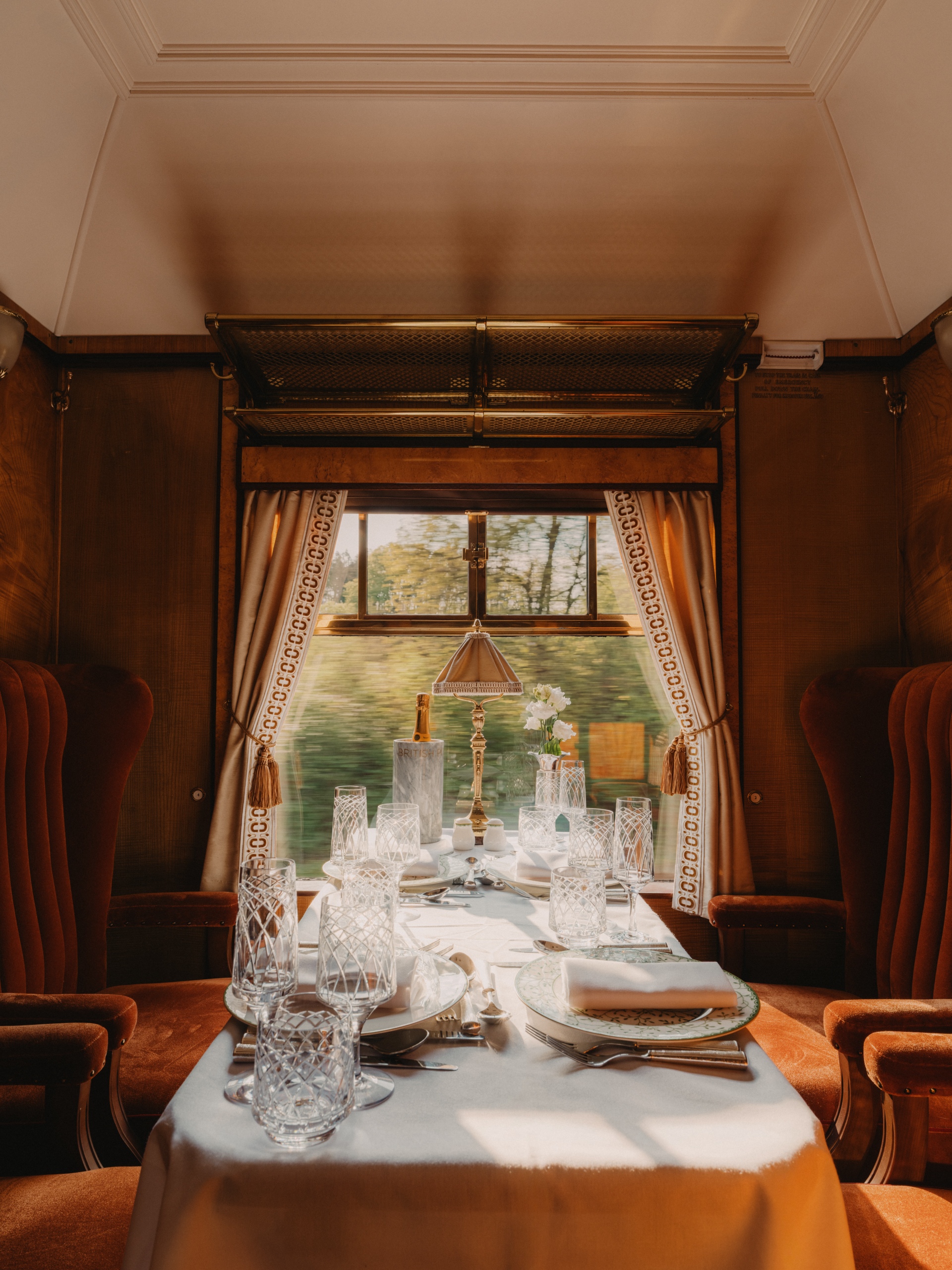 Panoramic view through a vintage train window overlooking the rolling English countryside