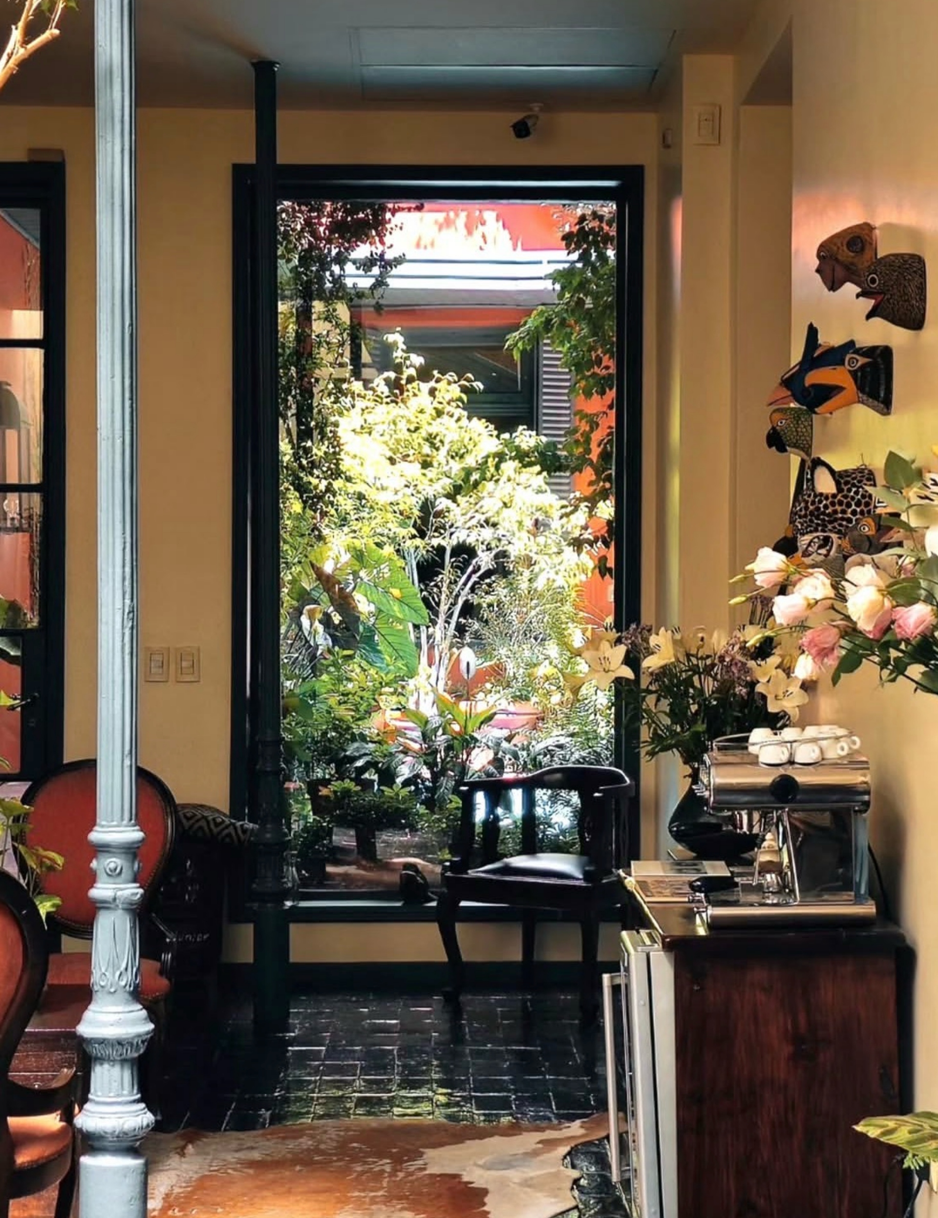 The unassuming front entrance bell of the former private residence, signaling an intimate arrival experience.