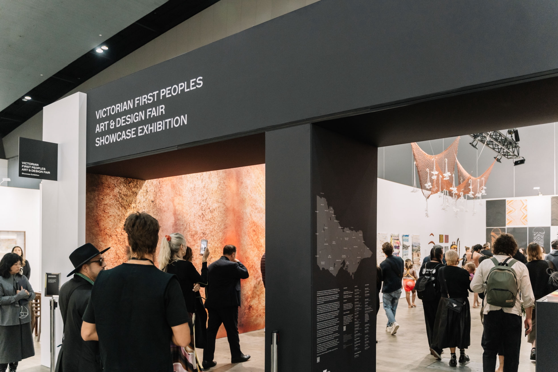 An interplay of clean architectural lines and diffused lighting across the exhibition booths