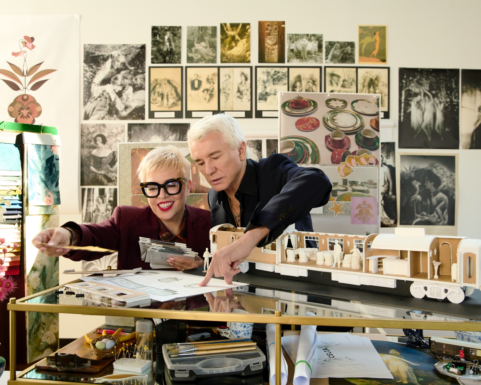 Dramatic luxury train carriage co-designed by filmmaker Baz Luhrmann featuring modern art deco aesthetics