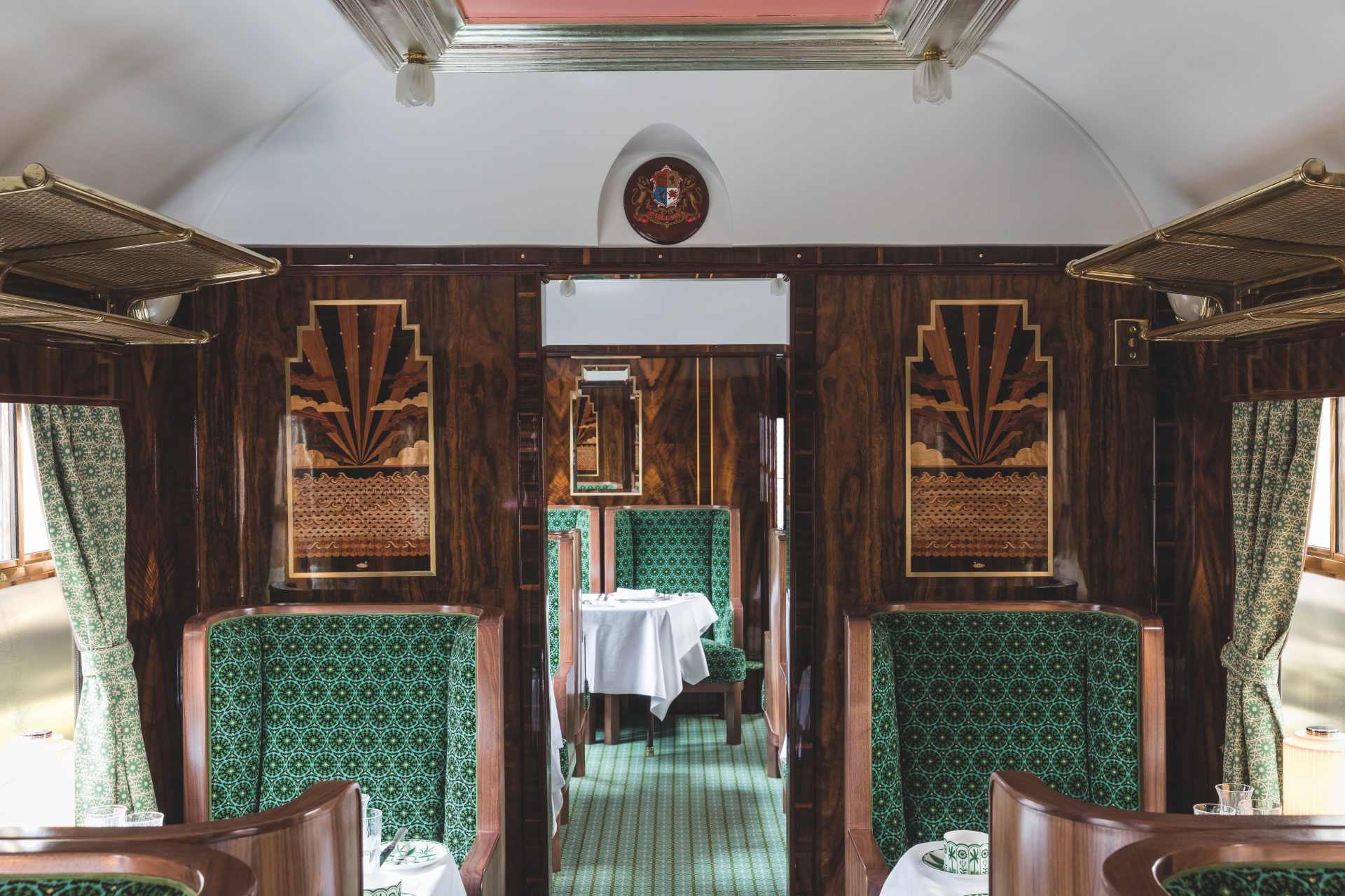 Wes Anderson designed Cygnus carriage on Belmond British Pullman with pastel symmetry